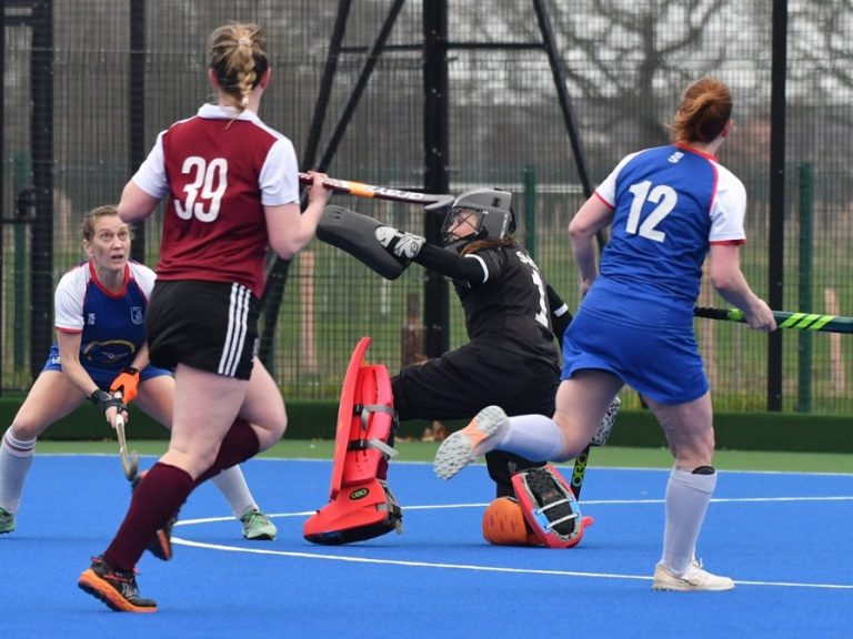 Bedford Hockey Club Ladies' 1st XI goalkeeper keeps out an opposition shot