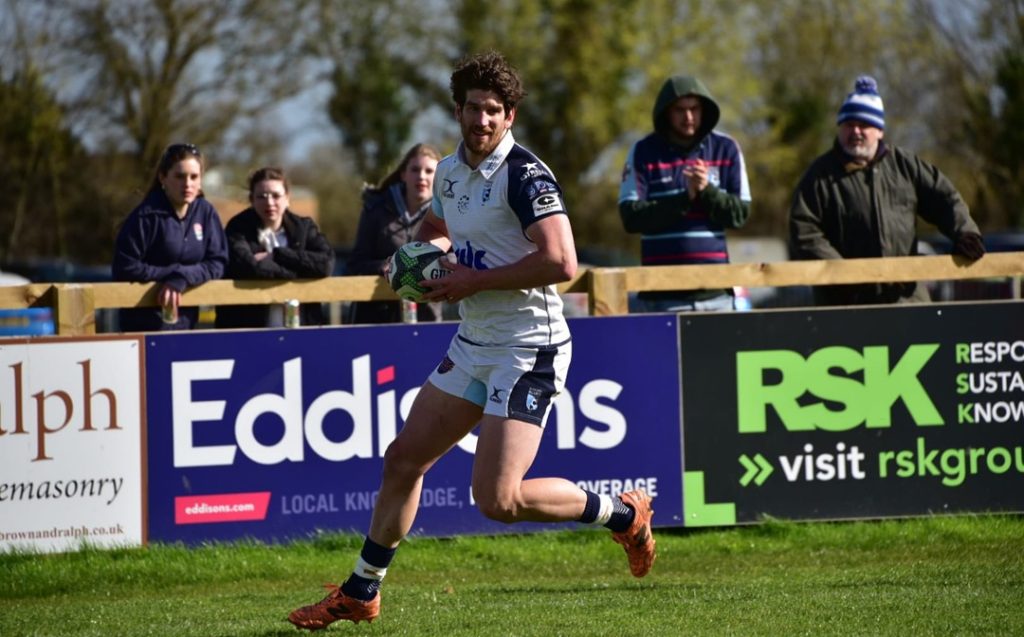 Michael Le Bourgeois for Bedford Blues in his white away kit at Cambridge