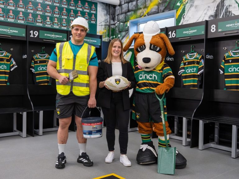 Northampton Saints prop, Danilo Fischetti, with the Saints mascot and Alison Wong from Travis Perkins