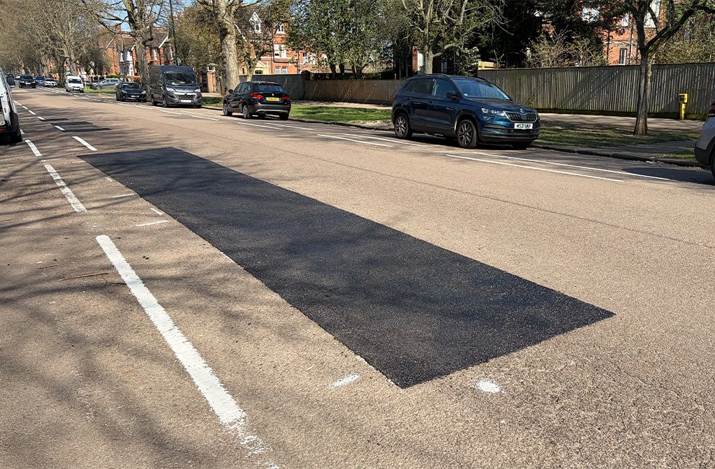 Potholes filled after white lines had been painted along De Parys Avenue Image Bedford Independent