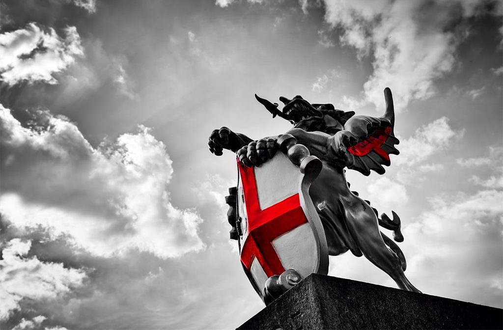 St. George dragon statue in London, the UK. Symbol of England. Black and white with red St. George's Cross Image: PHOTOCREO Michal Bednarek shutterstock