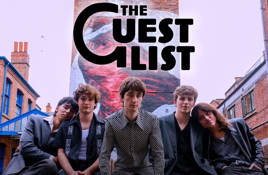 The five members of the band The Guest List pictured in a street in front of a large mural