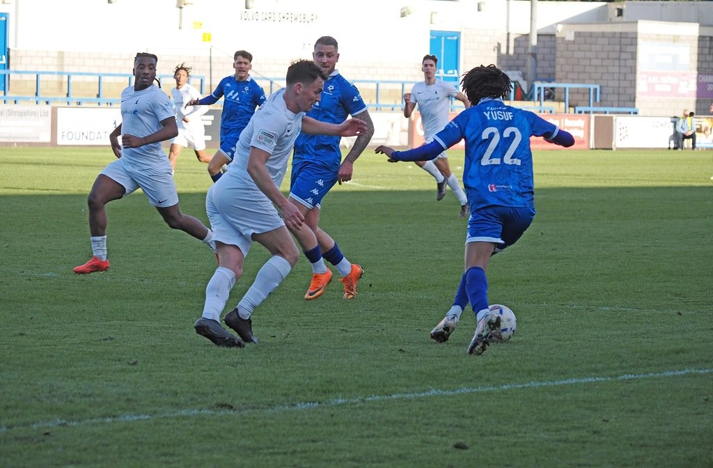 Twariq Yusuf of Bedford Town taking on a Telford defender