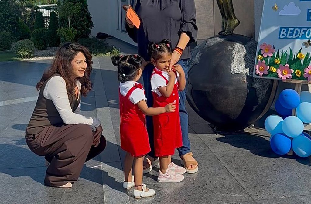 Two young girls on their first day at their new school.