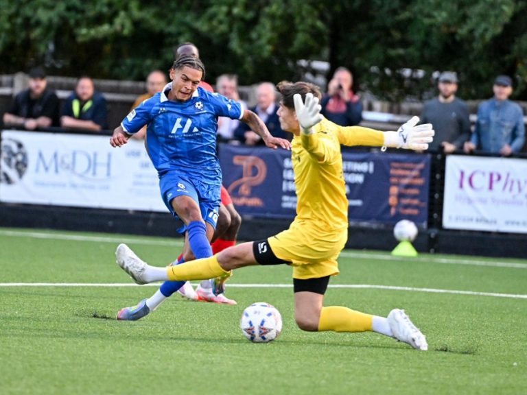 Bedford Town attacker Ellis Brown places the ball past the Telford goalkeeper en route to scoring against Telford at The Eyrie
