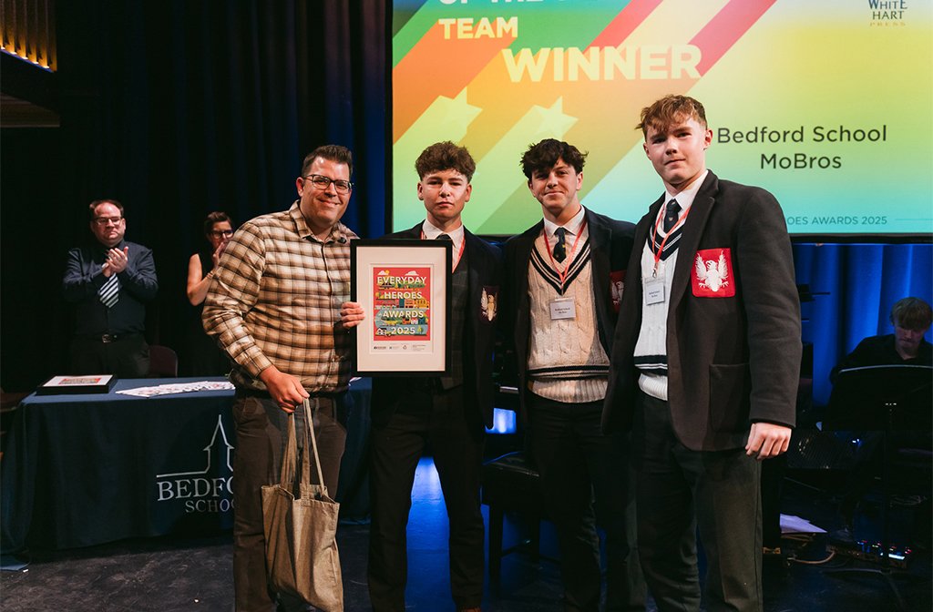 Fundraiser of the Year (team) 2025 winners - Bedford School MoBros (r) with Daniel O'Loughlin of White Hart Press. Image: Bedford Independent.