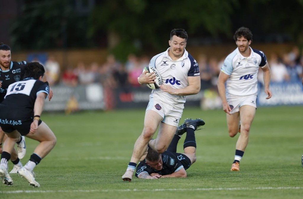 Bedford Blues' Lucas Titherington breaks away from a Coventry tackle at Goldington Road