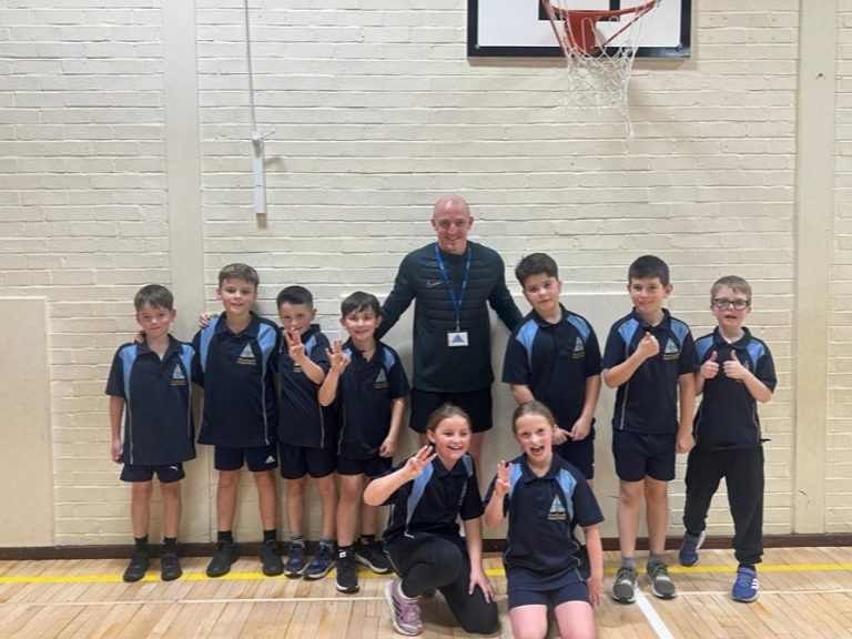 PE lead of five years, Matt Phelan with the students of Pinchmill Primary School.