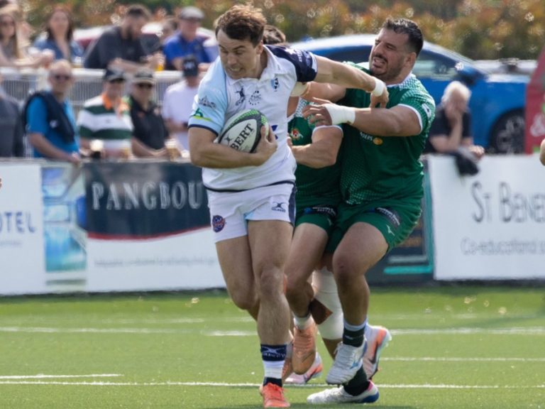 Bedford Blues' Ryan Hutler tries to break clear from a tackle by an Ealing defender in May 2026