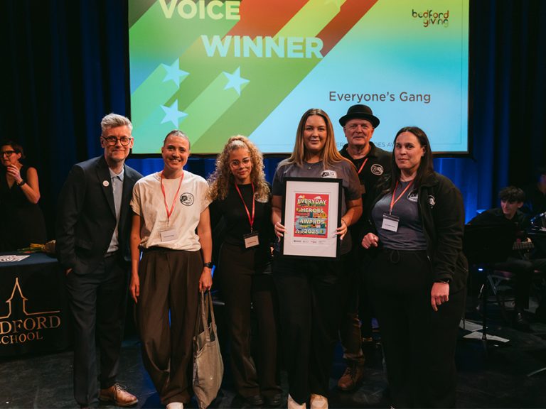 Youth Voice 2025 winners, Everyone's Gang (r) with Paul Kellett of Bedford Giving. Image: Bedford Independent.