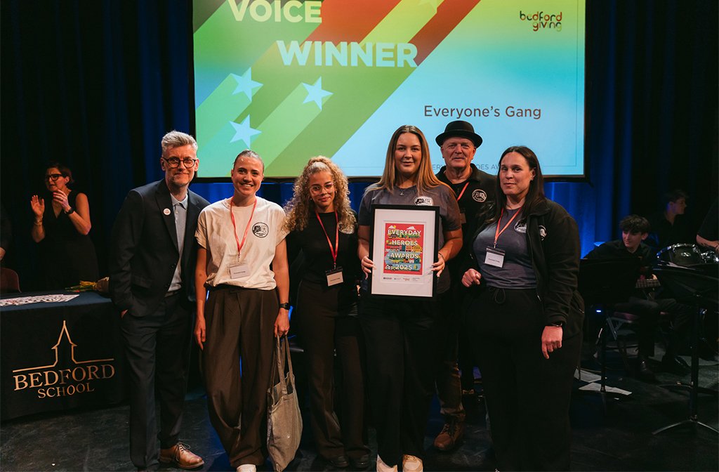 Youth Voice 2025 winners, Everyone's Gang (r) with Paul Kellett of Bedford Giving. Image- Bedford Independent.