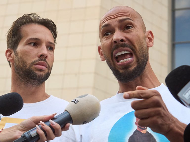 Andrew Tate (R) and his brother Tristan Tate (L) outside the Bucharest Court in Aug 2024 Image LCV Shutterstock