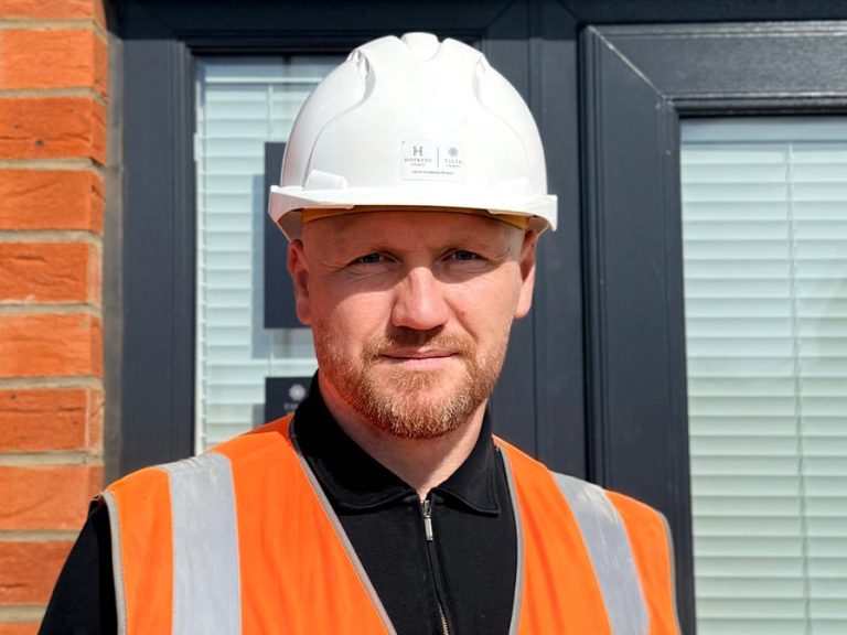 Site Manager Andrew Webb, pictured in his PPE, received a prestigious NHBC Pride in the Job Award. Image: untypical Group.