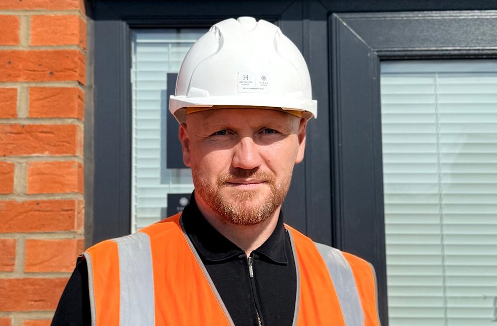 Site Manager Andrew Webb, pictured in his PPE, received a prestigious NHBC Pride in the Job Award. Image: untypical Group.