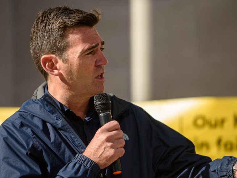 A photo of Andy Burnham, former Mayor of Manchester, speaking to a crowd of people
