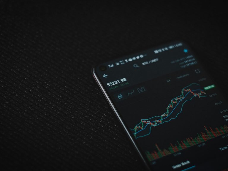 Black android smartphone on black textile Image Viktor Forgacs Unsplash