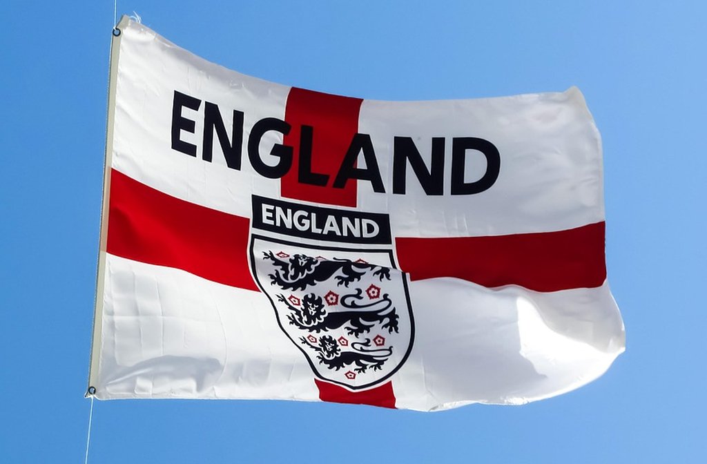 The England football team's Three Lions insignia on an England flag. Image Pixaby dimitrisvetsikas1969