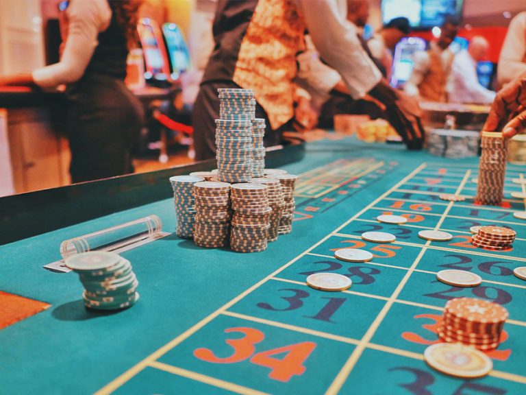 A casino table with a lot of chips on it. Image: Kaysha/Unspalsh