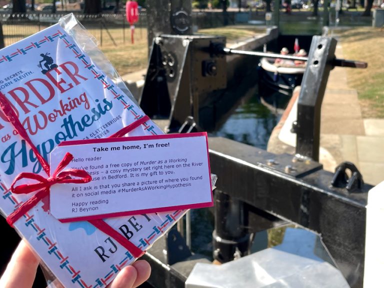 A copy of RJ Beynon's Murder as a Working Hypothesis book being dropped along the River Great Ouse. Image RJ Beynon