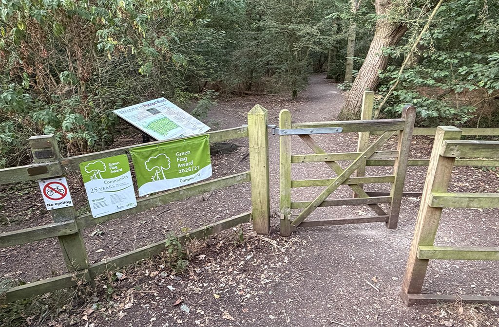 An entrance to Putnoe Woods in Mowsbury Park showing its Green Flag award Image Bedford Independent