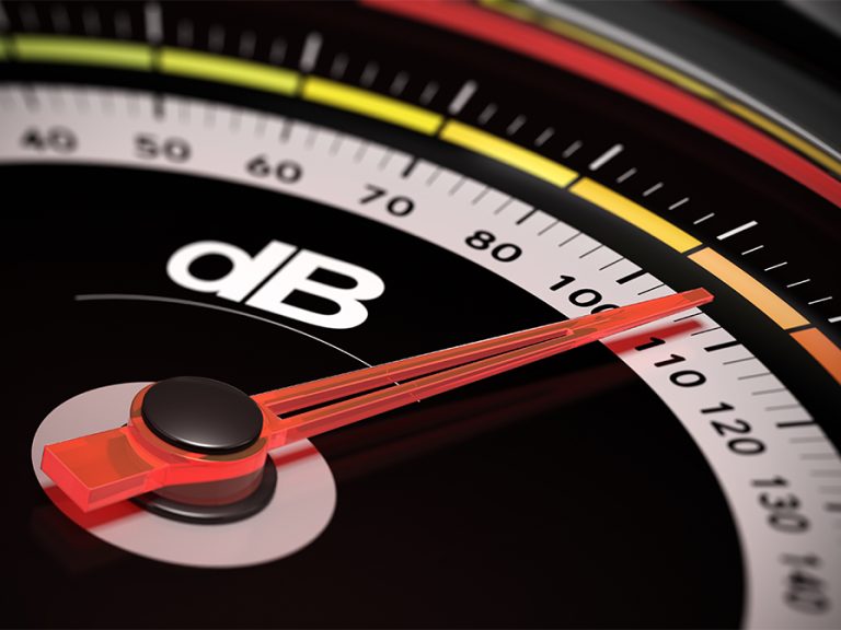 Decibel measurement. Gauge with green needle pointing 105 dB, concept of noise level Image Olivier Le Moal Shutterstock