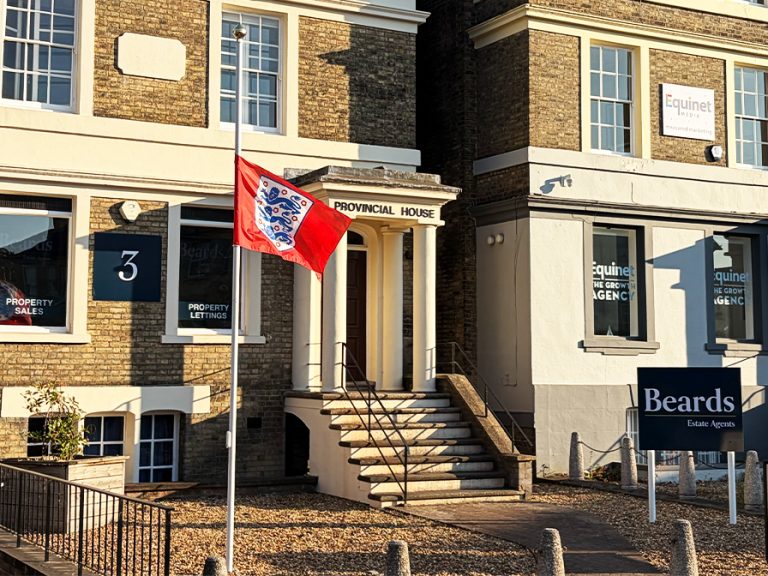 England football flag at half mast outside Beards Estate Agents after the men's team's exit July 2026. Image: Bedford Independent.