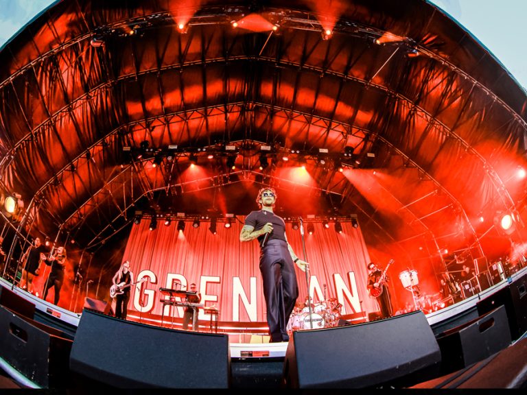 Fish-eye lens photo of Tom Grennan at Bedford Summer Sessions. Image Donna Samuels Event Photography:Cuffe & Taylor