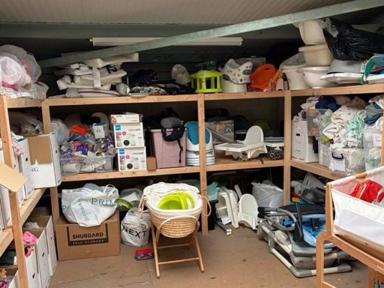 A selection of the items provided to families in need by FACES BabyBank. The warehouse shelves have baby essentials and there is a Moses basket, potties and other equipment.