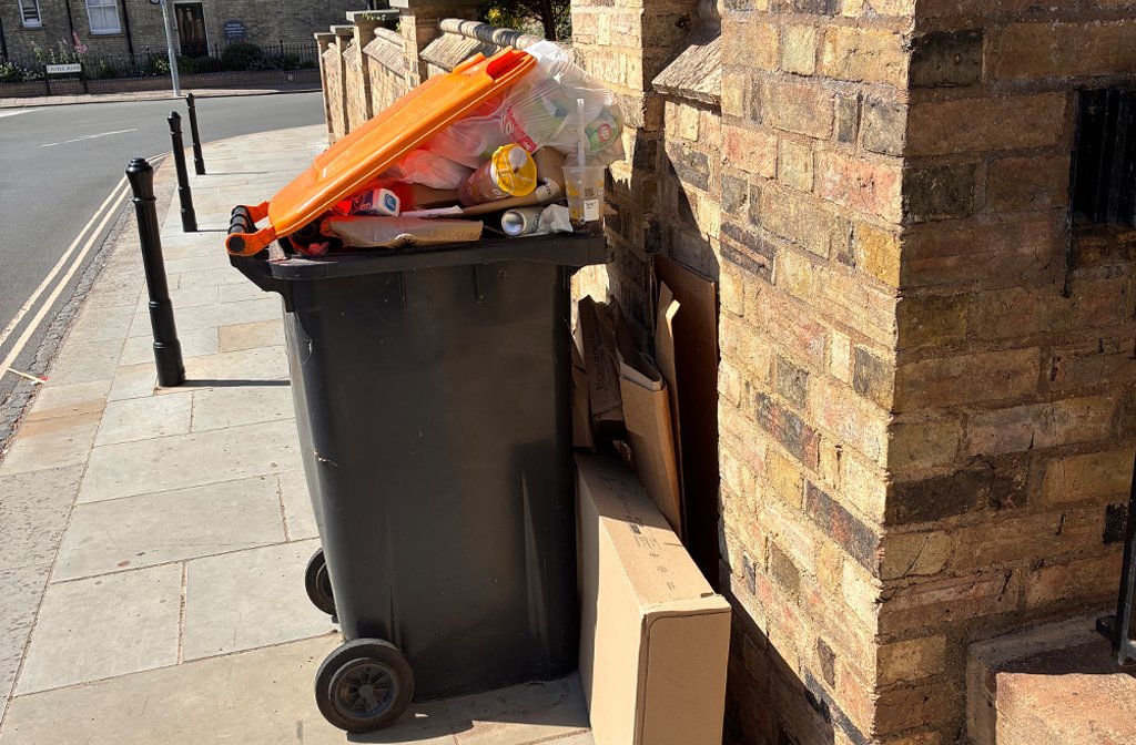The overflowing wheelie bin outside Sacred Heart of Jesus and St Cuthbert Church, Mill Street Image Parish Community