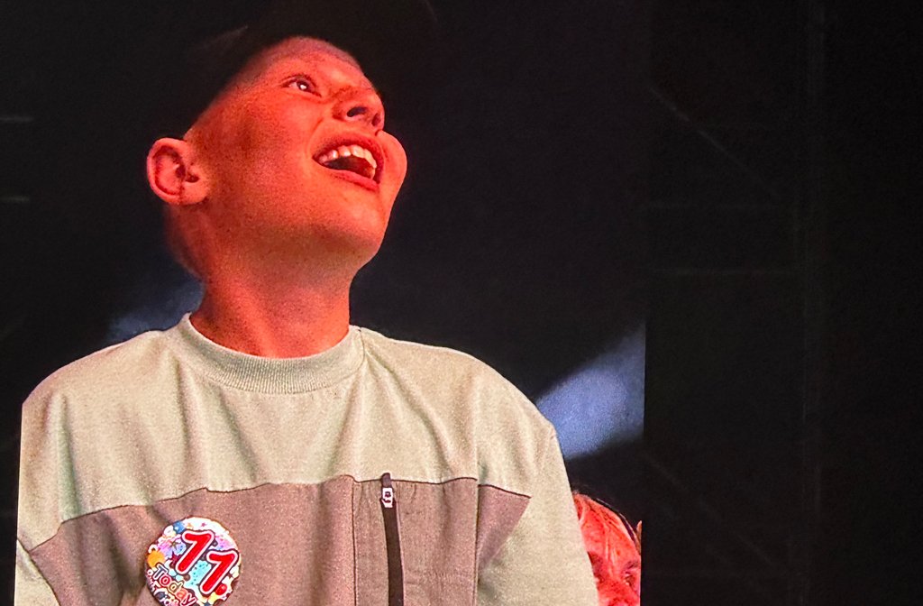 A young lad with a birthday badge on is in the crowd at the Tom Grennan gig at Bedford Summer Sessions 2026