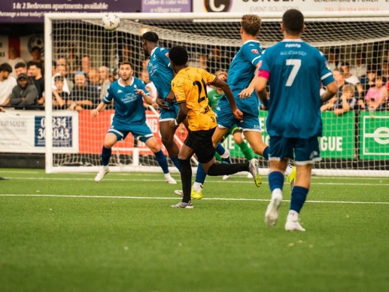 Real Bedford's CJ Kiala curls a shot towards the Bedford Town goal in the Bedfordshire Senior Cup final