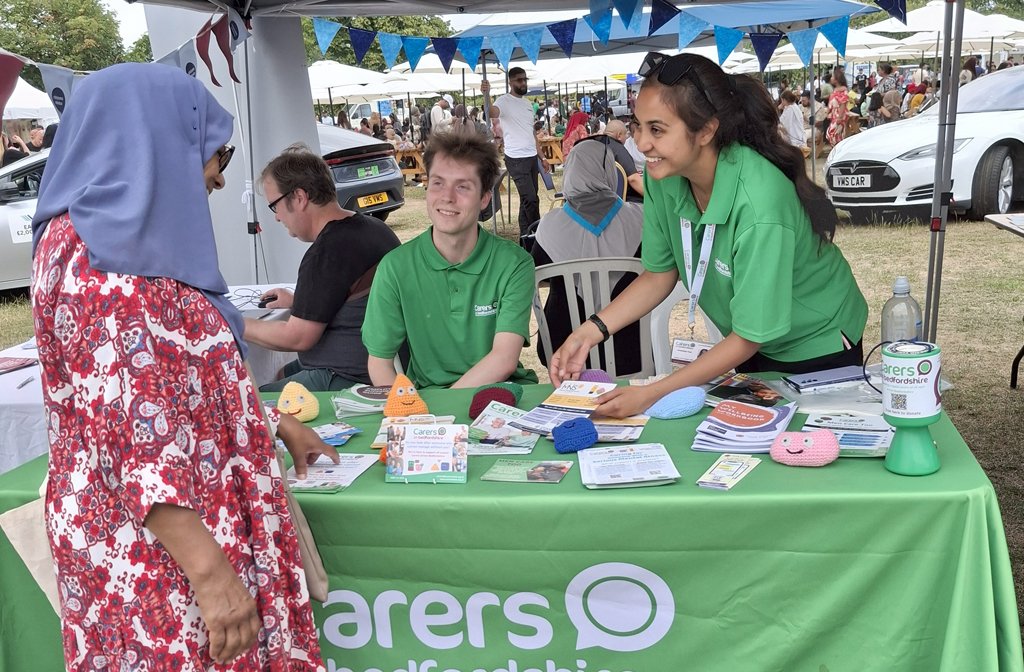 Carers in Bedfordshire volunteers Amandeep and Cal at Eid festival. Image Carers in Bedfordshire