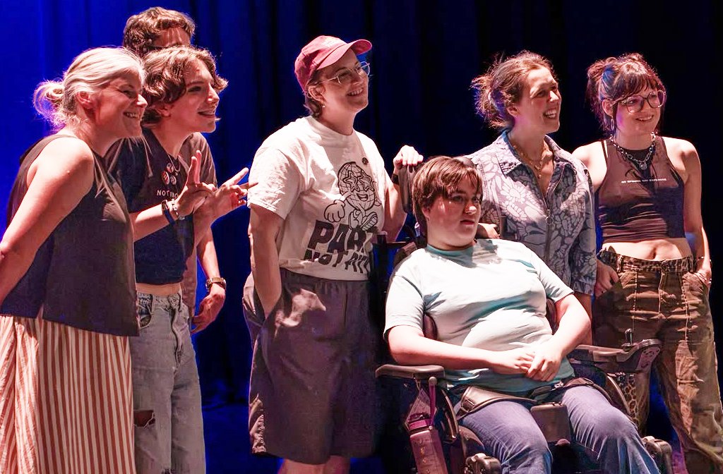 Performers Fred, Samuel, Aisling, Charlotte and Abbie with Rosie Jones on stage at the Quarry Theatre. Image Inclusive Performing Arts Festival