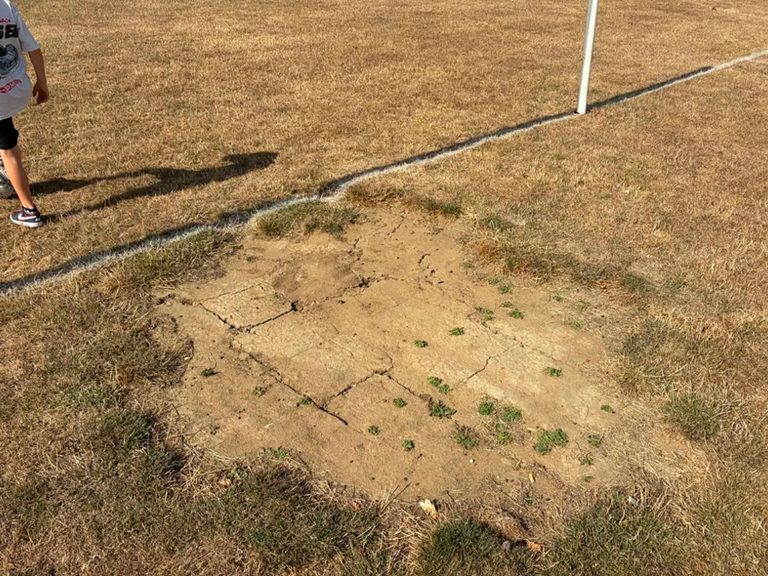 A hard, dry patch of ground between a goal at Mowsbury Park, demonstrating its danger to players