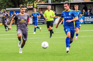 Bedford Town's Josh Castiglione battles for the ball at Spalding