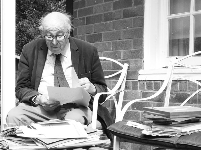 Local historian Simon Houfe in the garden of Avenue House in Ampthill surrounded by papers. Image Houfe family